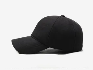 Close-up of side profile on thick black wool baseball cap with silver metal trim detail