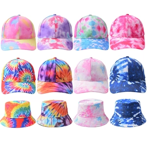 Colorful tie-dye collection featuring baseball caps and bucket hats in various vibrant patterns