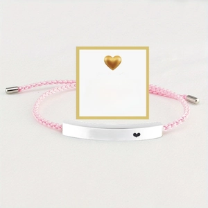 Pink woven adjustable bracelet with Just Breathe engraved metal bar on an inspiring card