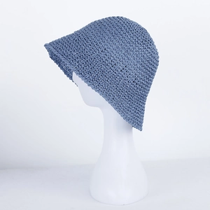 Detail showing the intricate crochet texture of this blue woven straw bucket sun hat