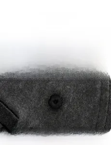 Detailed close-up of embroidered breathable eyelets on a black vintage baseball cap