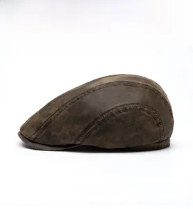 Side view of dark brown vintage ivy cap with distressed matte leather texture