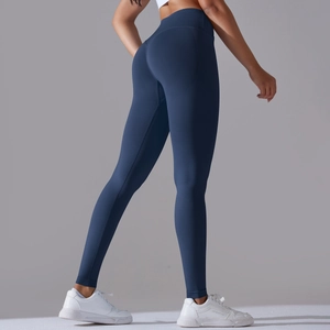 Close-up of seamless dark blue yoga leggings showing high waist and peach lift effect