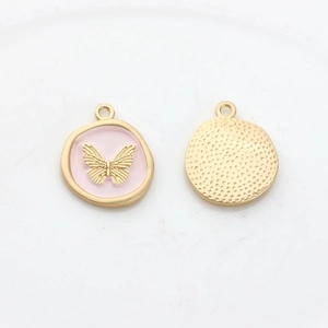 Detail of pink enamel butterfly charm showing front design and textured back finish