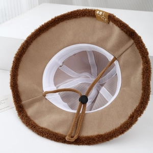Baby panda bucket hat with plush trim and adjustable cord in khaki and brown tones