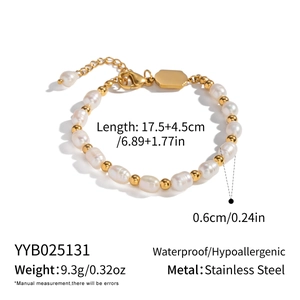 Detail view of pearl and gold stainless steel bracelet with sizing and material specs