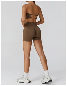 Detail of seamless high-waist yoga shorts with scrunch butt lifting design in brown