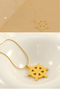 Detail of 18K gold stainless steel helm pendant necklace with elegant snake chain links