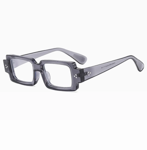 Detailed macro view of dark grey rectangular frame sunglasses with silver rivets