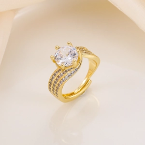 Close-up of golden adjustable ring with 3-carat round zircon and pavé diamond details