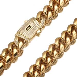 Gold Cuban link chain necklace featuring a zircon-encrusted clasp with an S logo