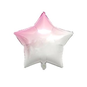 Detail of star-shaped foil balloon with soft pink and white gradient color for parties