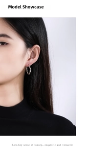 Close-up of S925 sterling silver earring with wave texture worn by a female model