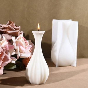 Detailed view of the striped vase silicone mold alongside the finished wax candle product
