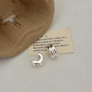 Minimalist 925 sterling silver thick C-shape hoop earrings with a polished metallic finish