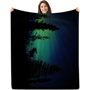 Detail of digital print flannel blanket featuring aurora sky, forest, and deer silhouette