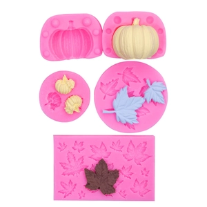 Detail of pink silicone molds for Halloween pumpkin and maple leaf baking and DIY crafts