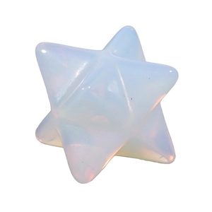 Macro shot of translucent milky white crystal Merkaba star with subtle iridescent finish