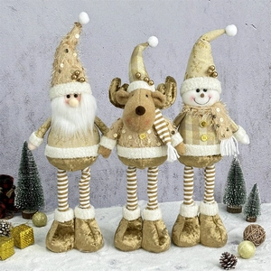 Three Christmas plush dolls with reindeer, snowman and Santa in gold and beige holiday tones