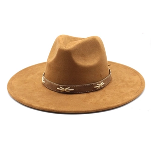 Detail of vintage camel wool fedora hat featuring a brown leather band with cross-stitch