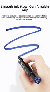 Macro detail of dual-tip marker pen drawing a Prussian Blue stroke on white paper