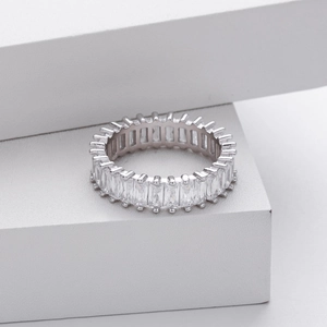 Macro shot of silver S925 ring with channel set rectangular cubic zirconia stones