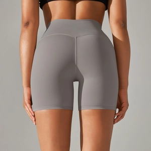 Detail view of high waisted grey yoga shorts with seamless texture and lift effect