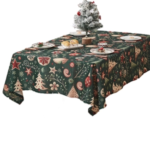 Green Christmas tablecloth with festive tree and snowflake patterns for holiday dining decor