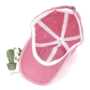 Pink washed cotton baseball cap with vintage finish and metal buckle closure