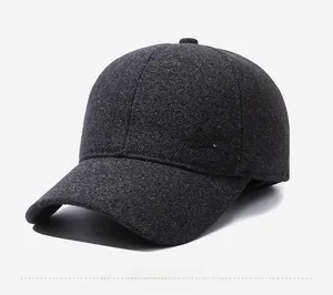 Detail of dark grey wool baseball cap showing thick twill fabric and gold lightning logo