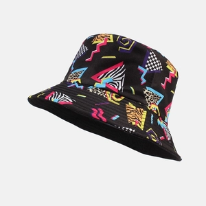 Detail view of vintage bucket hat featuring neon geometric patterns and animal prints