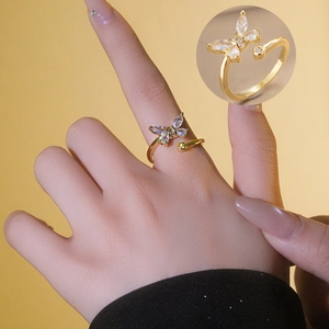 Elegant gold butterfly zircon open ring worn on finger with a detailed close-up view