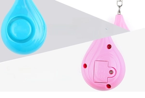 Detail of blue and pink drop-shaped personal alarms showing 130dB volume and battery compartment