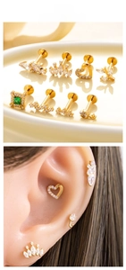 Detailed view of G23 titanium gold stud earrings set featuring crown and emerald zircon