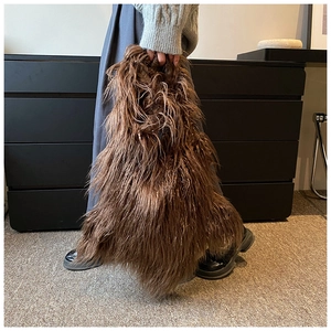 Brown fluffy plush shoulder bag styled with a neutral winter outfit for a trendy look