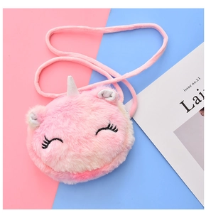 Detail of plush unicorn crossbody bag with soft pink faux fur and silver glitter horn