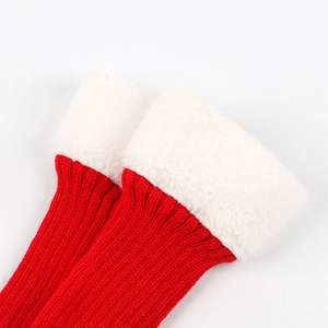 Red knit leg warmers with white faux fur trim for winter and Christmas holiday wear