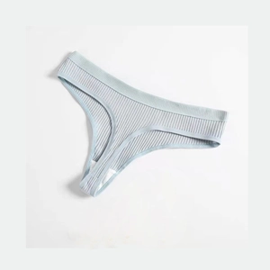 Detail view of light blue ribbed thong featuring high-elastic cotton fabric and seamless edges