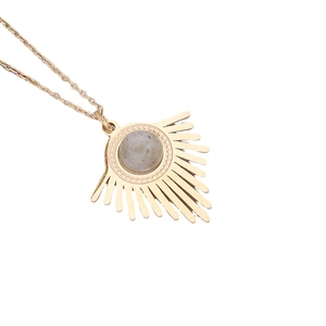 Golden stainless steel sunburst necklace with a round beige natural stone pendant on white background