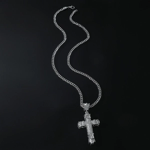 Mens silver alloy cross pendant necklace with sparkling rhinestones on black background