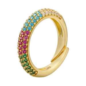 Detailed macro view of gold-tone ring with multi-color micro-pave zircons and open design
