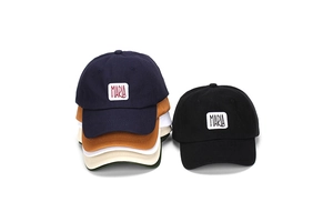 Detail of embroidered MARIA patch on various colors of retro style cotton baseball caps