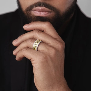 Close-up of two-tone braided metal ring with pavé-set zircon for a stylish luxury look