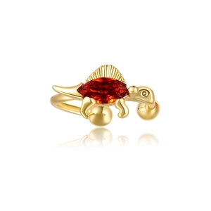 Macro detail of dinosaur ear cuff in 18K gold finish with marquise red gemstone
