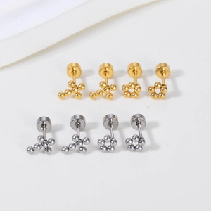Minimalist irregular metal cross and flower stud earrings in gold and silver steel