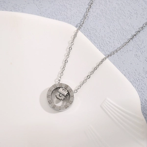 Silver titanium steel necklace with Roman numeral rings and zircon inlay on a white tray