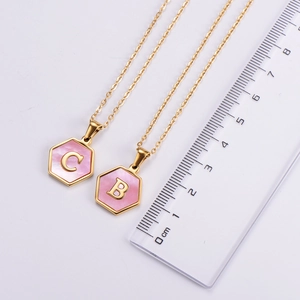 Hexagon pink shell pendant necklace with 18k gold plating and C and B letters