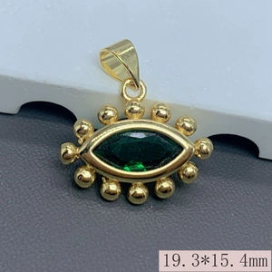 Macro view of gold devil eye pendant with green stone and 19.3*15.4mm size scale