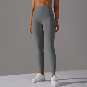 Detail of high-waist dark grey yoga leggings with seamless waistband and elastic fit