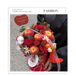 Detail of Christmas hug bucket with red roses, fresh apples and pine needles gift set
